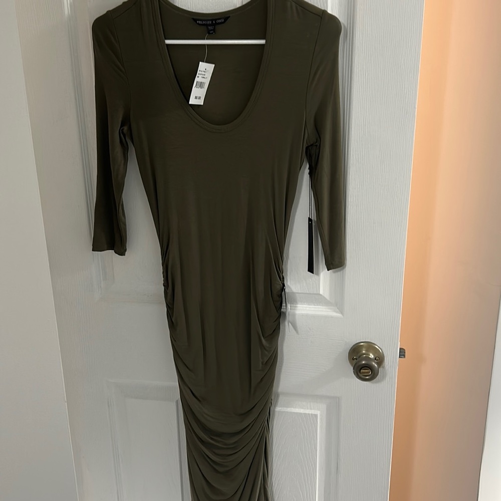 Long green dress, gathered detail on side.